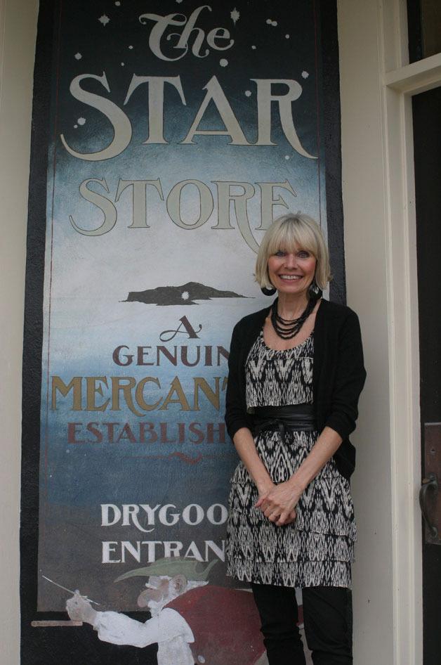 Tamar Felton stands in front of the Star Store where she is busy getting ready for Langley's Fun and Fashion Weekend.