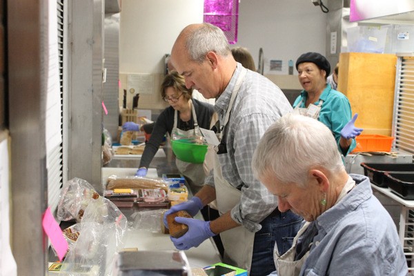 Congressman Rick Larsen swung by Whidbey Island Nourishes Thursday. He helped make sandwiches.