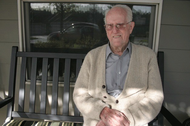 Leland 'Mac' McCloskey sits for a moment in the sun outside the Maple Ridge Assisted Living Community facility where he lives.