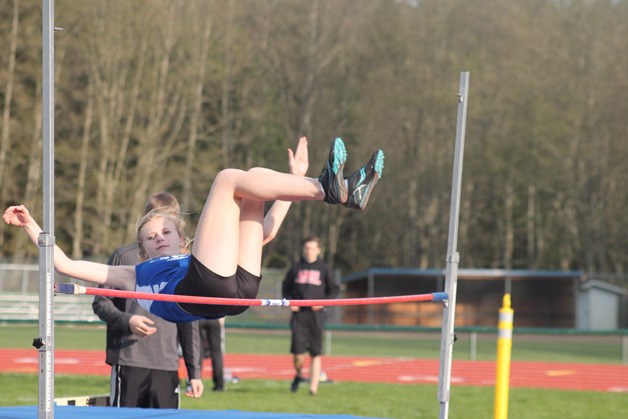 Zoe Tapert sails over the high jump bar April 2.