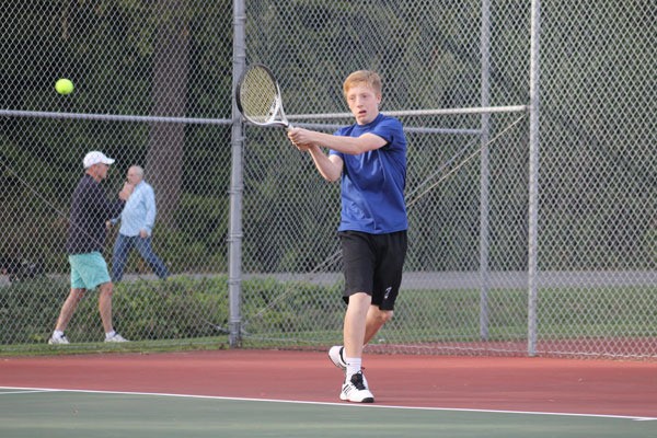 Falcon senior Michael Hastings returns a shot during South Whidbey’s Senior Day tennis match against Bush.