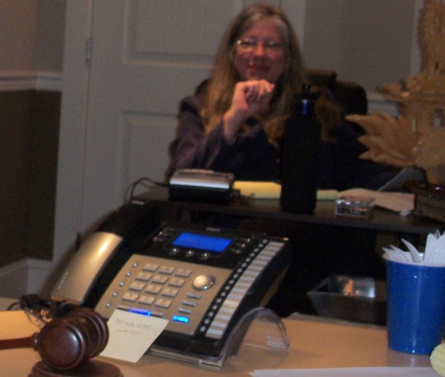 Port of South Whidbey Commissioner Chris Jerome participated by telephone during a special meeting Tuesday. Clerk Molly McLeod-Roberts lists as Jerome