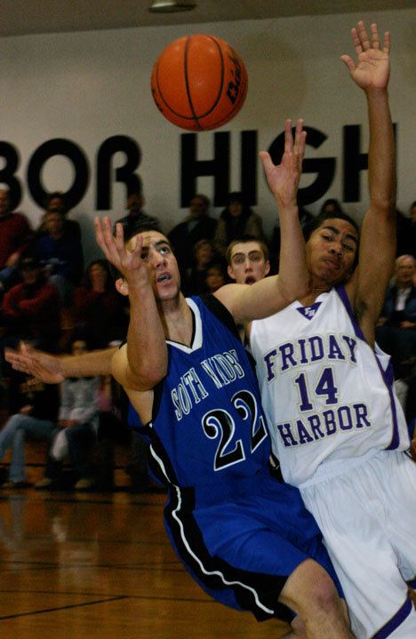 Falcon Jordan Thornley fights for the ball against Friday Harbor's Diante Scott during Saturday's 69-60 win over the Wolverines.