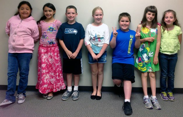 All-Island Reading Challenge contestants from South Whidbey Elementary School smile after placing third in the Sno-Isle Libraries competition. From the left are Janessa Martinez