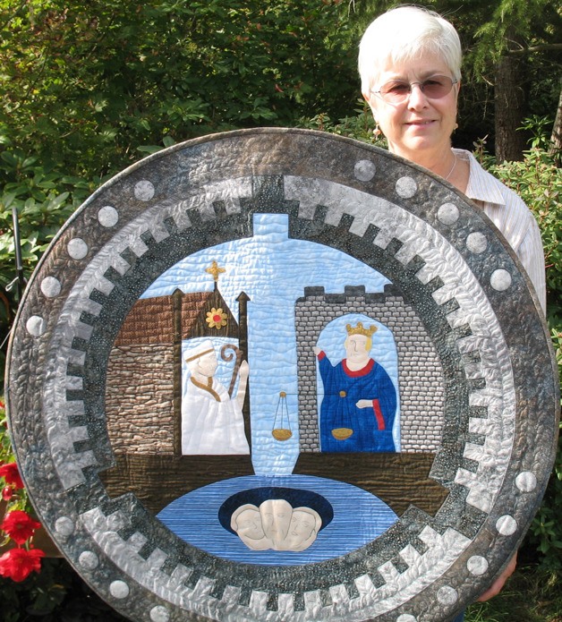 Beth Whitman quilted this wall hanging that depicts a manhole cover from Bergen