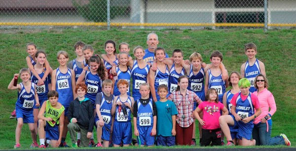 The Langley Middle School cross country team celebrates their boys and girls team titles