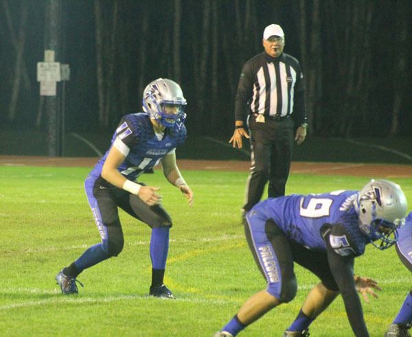 Senior quarterback Charlie Patterson awaits a snap during South Whidbey’s Homecoming game against Cedarcrest. The Falcons lost