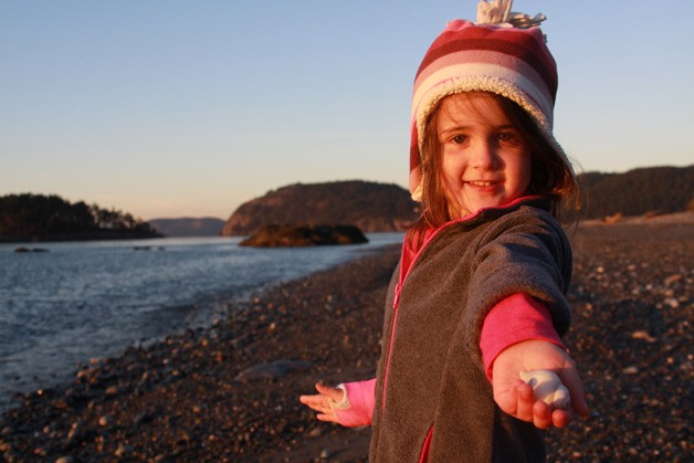 Haylee Fortinberry shows off a treasure at Deception Pass State Park. The park is the busiest in the state and had a great year in 2014.
