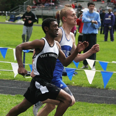 Falcon Sam Lee is challenged for first place in the mile by Port Townsend’s Habtamu Rubio