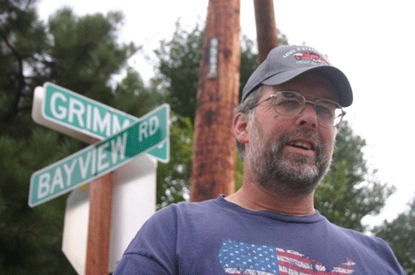 Brian Grimm at the beginning of the road named for his grandfather.