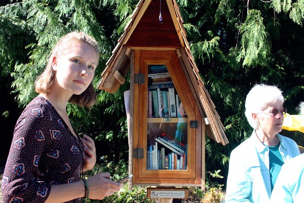 Marena Salerno Collins stands in front of Langley’s first Little Free Library. Her mother