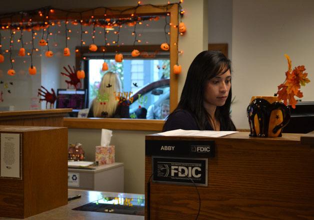 Whidbey Island Bank employee Abby Alba works as a teller at the Coupeville branch.