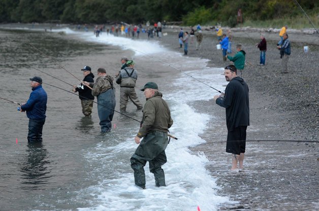 Anglers cast their lines last summer at Bush Point. The Washington Department of Fish and Wildlife will offer two free days of fishing June 11-12.