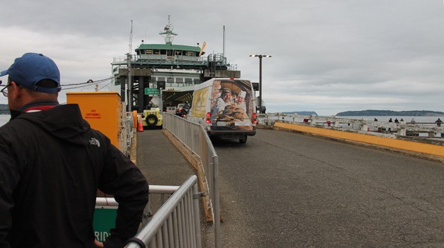 Vehicles load onto the M/V Tokitae at the Mukilteo Ferry Terminal on Friday while a walk-on passenger waits to board. Recently