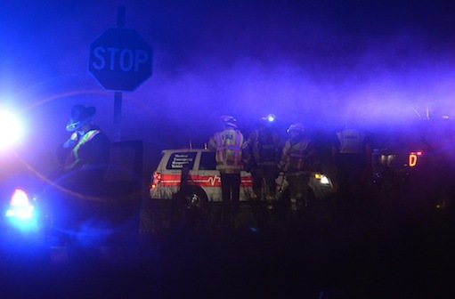 State police and South Whidbey Fire/EMS firefighters work at a fatal accident scene near Coles Road on South Whidbey Saturday night.