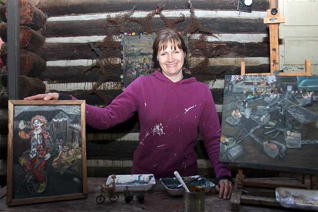 Allegra Rose Brown displays paintings she will exhibit during a one-night show