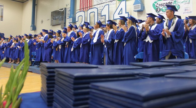 South Whidbey High School seniors stand to recognize retiring art teacher Don Wodjenski during their graduation ceremony June 7.