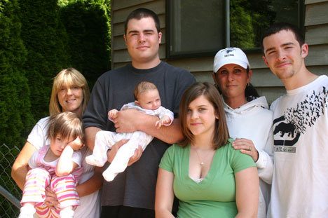 Toddle Inn through the generations: Jil Helland (left) holds her granddaughter Alina Allan; Jason Shoudy