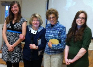 Whidbey Audubon Society members [center] pose for a photo with 2014 scholarship awardees Caitlyn Connolly of Coupeville and Rachel Crowther of Oak Harbor.