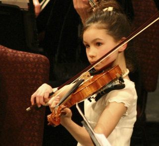 Violinist Tera Applegate is one of several young island musicians who play with the Whidbey Island Youth Orchestra for a season of concerts.