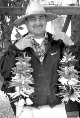 Prolific pepper producer Hilario Alvarez  shows off an abundance of peppers that brighten up many Seattle area farmers markets.