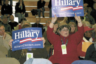 A Hillary Clinton supporter waves her sign during Saturday’s Island County Democrats convention in Langley.