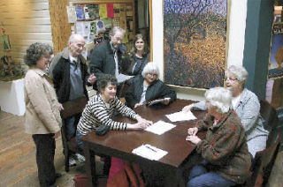 The members of MoveOn Whidbey talk about the cost of war as a part of the national MoveOn event this week. Micky Sarkis