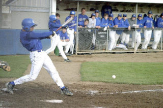 Mick Poynter swings hard Monday as South Whidbey tries to keep up with the league’s top-seed