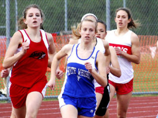 South Whidbey runner Erica Johnson paces the pack Friday early in the 800-meter distance run but ended in fifth place. Johnson later was part of the winning girls 800-meter relay event