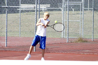 Freshman Riley Newman returns a serve last October during the final regular season match against Sehome. Newman qualified for state finals in Seattle on May 23-24.