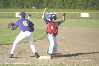 American Legion runner Robert Kirby heads back to first base after an unsuccessful steal attempt.