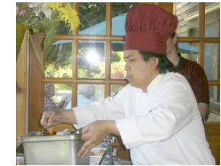 Chef Chung Tran cooks Vietnamese specialties during Whidbey’s Friendship Force fundraiser at the Basil Café in Bayview. The group is raising money to build a library in Vietnam.