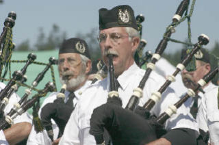 Bagpipers parade during last year’s Highland Games