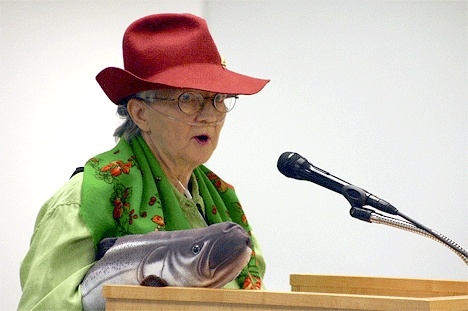 Theresa Marie Gandhi uses a stuffed fish as a prop to raise concerns Monday about the countys new wetlands rules.