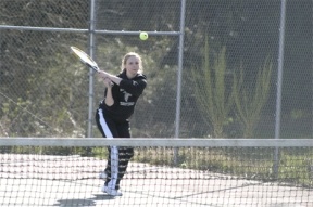 Falcon Katie Holt returns a serve on Monday. Holt and doubles partner Maya Hough won their match in two sets