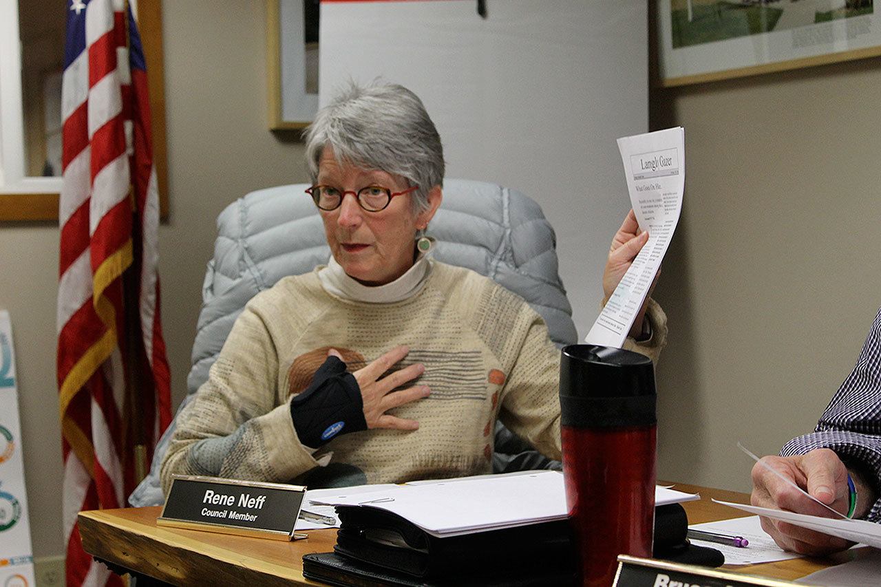 Evan Thompson / The Record Langley City Councilwoman Rene Neff holds up a copy of the “Langley Gazer,” a newsletter created anonymously that contained quotes from residents who opposed the council’s decision to close Seawall Park