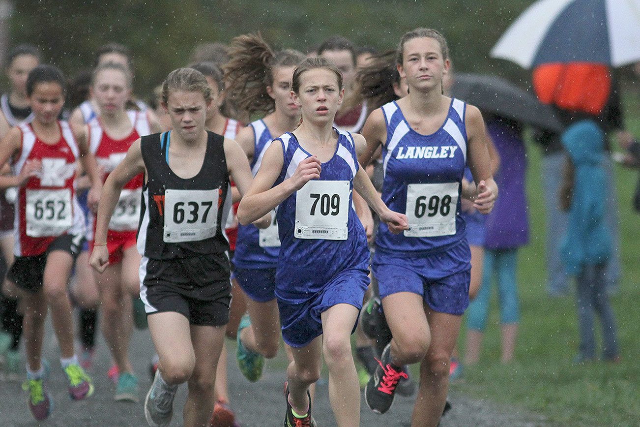 Matt Simms photo                                Langley Middle School eighth-grader Kaia Swegler-Richmond (front) leads the pack at the Cascade Conference Championships on Oct. 20 at River Meadows Park in Granite Falls. Swegler-Richmond won the league meet for the second year in a row.