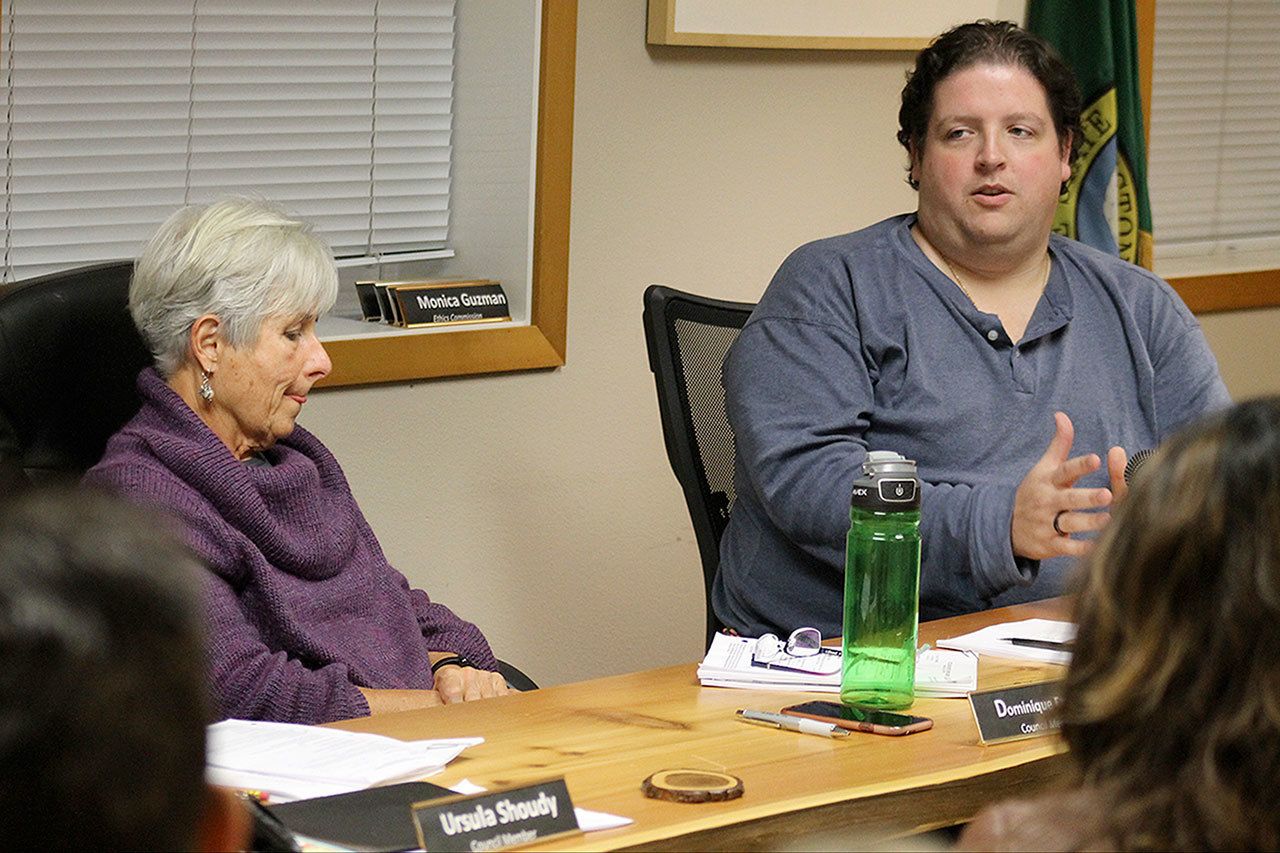 Evan Thompson / The Record Langley City Councilwoman Dominique Emerson (left) listens to Councilman Thomas Gill (right) explain his reasoning of wanting to close Seawall Park from 12 a.m. to 6 a.m. Emerson was the lone council member to vote against the closure of the park.
