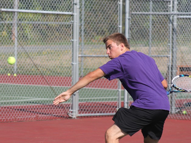 Falcon senior Jonathon Peterson reaches for a forehand in practice at South Whidbey High School.