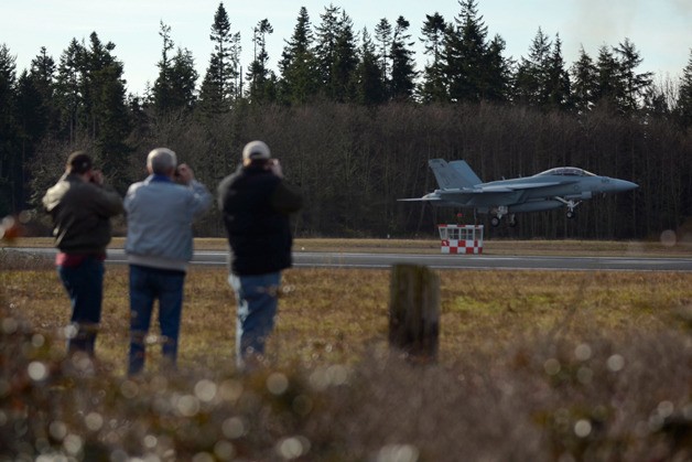 Spectators watch as a EA-18G Growler aircraft takes off from the U.S. Navy’s Outlying Field Coupeville. A study examining the noise impacts of the jets is underway and Port Townsend and the Sierra Club are the latest to voice concerns.