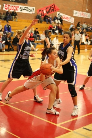 Falcons Jessica Manca and Samantha Pope defend against Coupeville’s Mandi Murdy Tuesday during South Whidbey’s 51-39 victory over the Wolves.