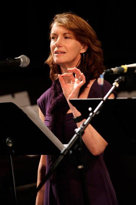Elizabeth Austen performs a poem during one of her readings as Washington State’s poet laureate.