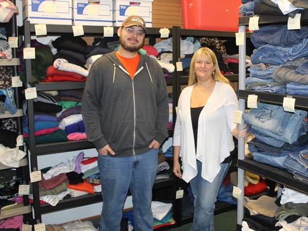 Dustin Hamren and Lori Cavender stand in the newly established clothing room at Ryan’s House for Youth.