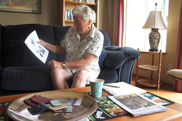 Langley storyteller Jill Johnson points out members of Berte Olson’s family