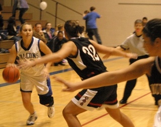 Falcon Alannah Alber tries to fend off Archbishop Murphy’s premiere defender Alyssa Smith Friday. South Whidbey lost to the Wildcats 74-32. At 5:15 p.m. Saturday