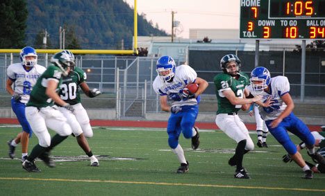 Falcon Jon Poolman plows through the Mount Vernon line as Chris Monell