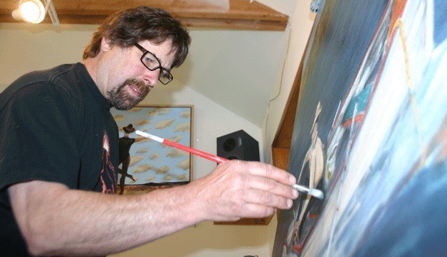 Bruce Morrow works on a painting in his studio. As one of the featured artists at Brackenwood Gallery for July