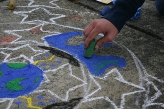 A young artist joins in the fun last year during the Langley Sidewalk Chalk Art Festival. The fourth annual chalk fest is Tuesday