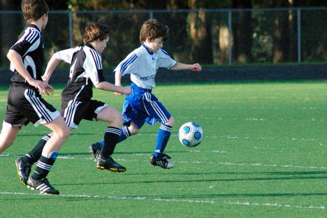 The Revolution’s Jordan Henriot makes a speedy getaway from his select soccer counterparts during a recent U-13 game.