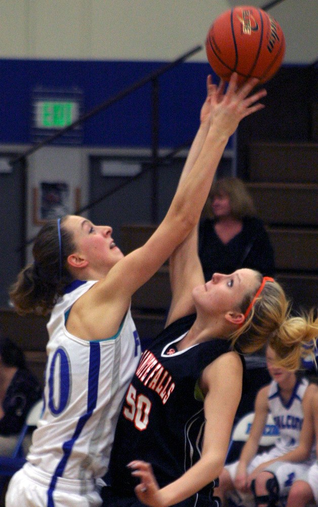 Annalies Schuster wins the tip against Granite Falls senior Chryssy Dolan on Tuesday night. Schuster and Dolan each scored a game-high 15 points
